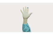 A hand gloved in Biogel Skinsense Indicator System glove