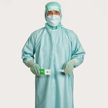 Healthcare professional demonstrating step 7 of gown donning