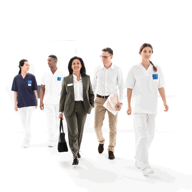 A photo of various health care professionals walking toward the viewer. 