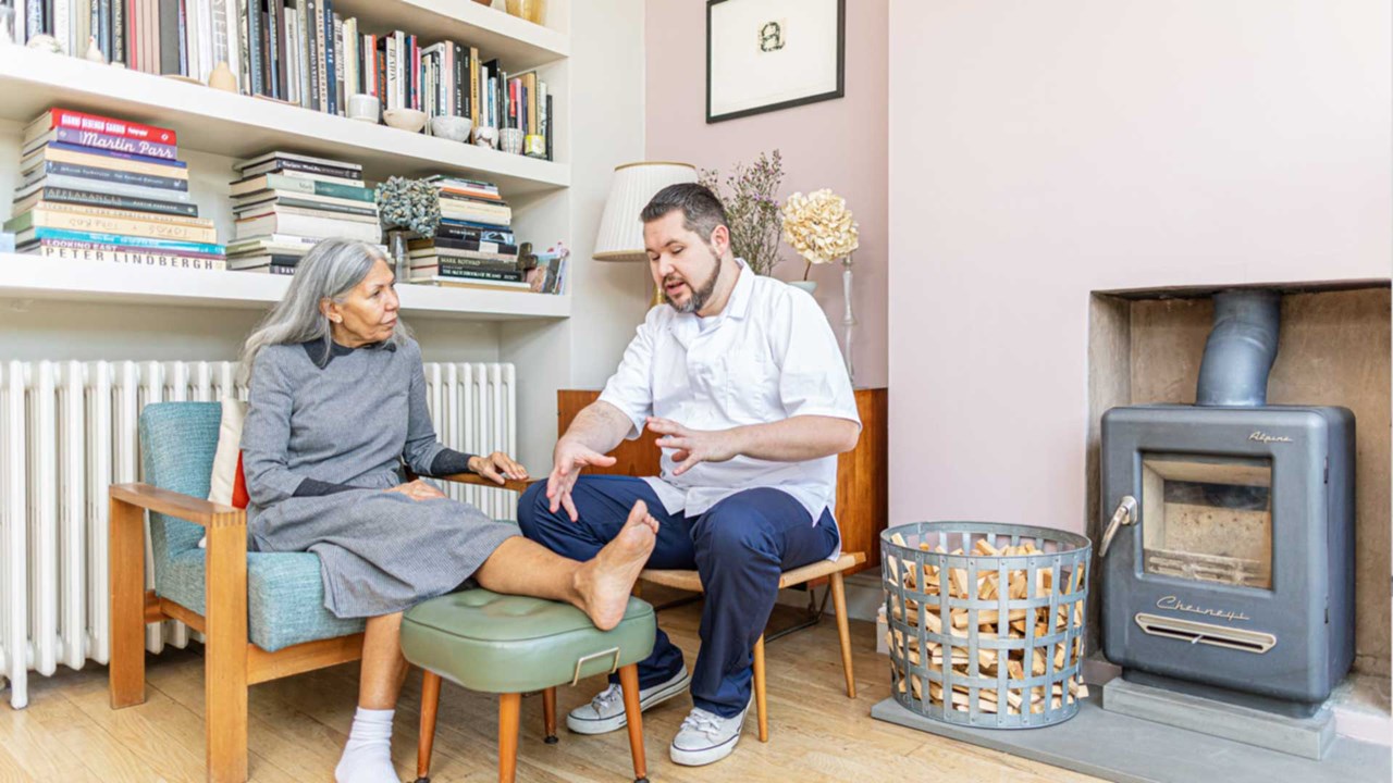 home care nurse talking with patient