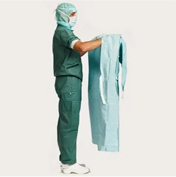 Healthcare professional demonstrating second step of donning a gown
