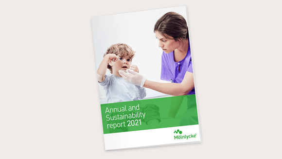 Cover of Mölnlycke integrated Annual & Sustainability Report 2021 with a child patient and a nurse