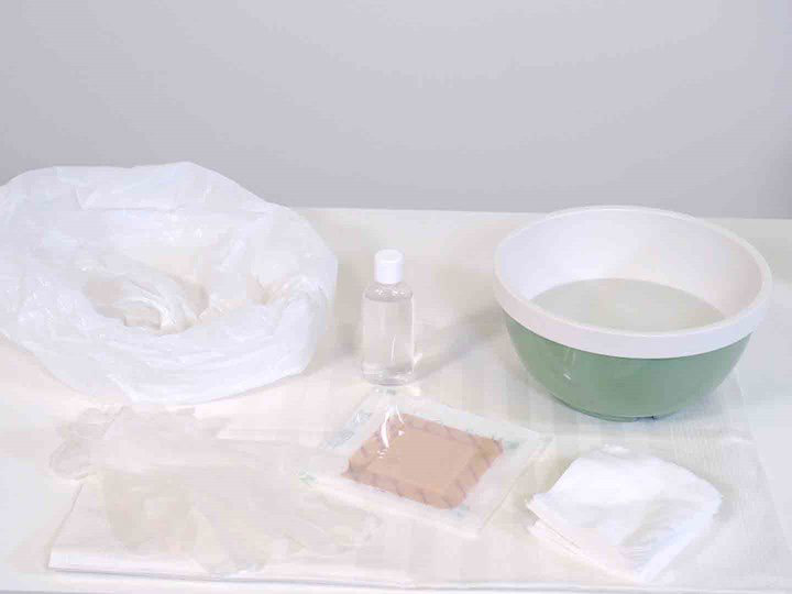 A photo of a table set up for doing a wound dressing change. 