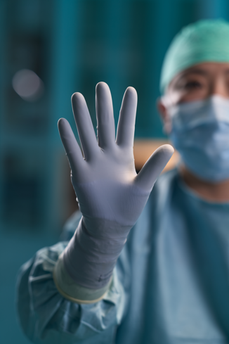 Surgeon wearing Biogel Gloves