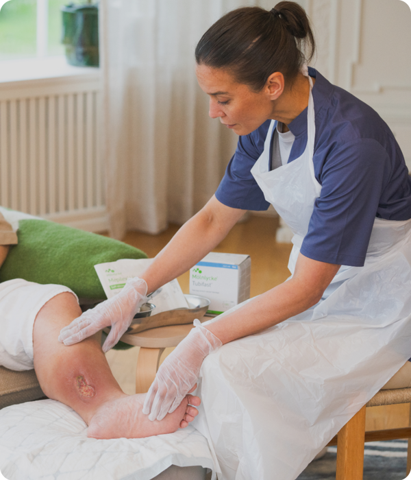 Healthcare professional assessing wound